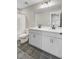 Bright bathroom featuring a double sink vanity, gray cabinets, and black hardware at 240 Lucca Dr, Summerville, SC 29486