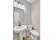 Bathroom featuring pedestal sink, toilet, and modern lighting at 240 Lucca Dr, Summerville, SC 29486