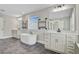 Spa-like bathroom with a freestanding tub, dual vanities, elegant fixtures, and spacious tiled flooring at 240 Lucca Dr, Summerville, SC 29486