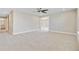 Spacious carpeted bedroom with neutral walls, ceiling fan, and a view to the bathroom at 240 Lucca Dr, Summerville, SC 29486
