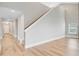 Inviting entryway with hardwood floors, stairs, and a view into the living area at 240 Lucca Dr, Summerville, SC 29486