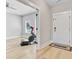 Inviting entryway with modern accents and a view of a workout room featuring a Peloton exercise bike at 240 Lucca Dr, Summerville, SC 29486