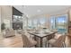 Open-concept living and dining area featuring hardwood floors, fireplace, modern furnishings and plenty of natural light at 240 Lucca Dr, Summerville, SC 29486