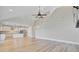 Bright open-concept living room and kitchen with hardwood floors and staircase at 240 Lucca Dr, Summerville, SC 29486