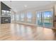 Bright living room featuring hardwood floors, a modern fireplace, and sliding doors to an outdoor patio at 240 Lucca Dr, Summerville, SC 29486