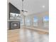 Spacious living room featuring high ceilings, modern fireplace, and light wood flooring at 240 Lucca Dr, Summerville, SC 29486