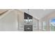 Living room featuring high ceilings, modern fireplace, and light wood flooring at 240 Lucca Dr, Summerville, SC 29486