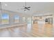 Open-concept living space with hardwood floors and natural light, flowing into the modern kitchen at 240 Lucca Dr, Summerville, SC 29486