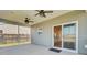 Screened-in patio with ceiling fans, an exterior door, and an outdoor living space at 240 Lucca Dr, Summerville, SC 29486