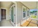 Open porch with wood decking and gray siding provides relaxing view of community at 240 Lucca Dr, Summerville, SC 29486