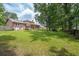 Wide shot of the expansive backyard with a well-maintained lawn, perfect for outdoor gatherings at 2425 Vistavia Rd, North Charleston, SC 29406
