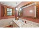 Bathroom featuring a large mirror, decorative lighting, and a marble countertop at 2425 Vistavia Rd, North Charleston, SC 29406