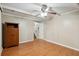 Cozy bedroom featuring wood-look floors, neutral paint, and ample natural light at 2425 Vistavia Rd, North Charleston, SC 29406
