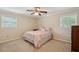 Bedroom featuring carpet, ceiling fan, and windows providing natural light at 2425 Vistavia Rd, North Charleston, SC 29406