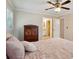 Bedroom featuring soft pink bedding, neutral walls, and a view into the bathroom at 2425 Vistavia Rd, North Charleston, SC 29406