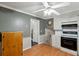 Functional kitchen with white cabinets, laminate counters, black appliances and wood floor at 2425 Vistavia Rd, North Charleston, SC 29406