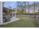 Landscaped backyard with a screened porch, providing a perfect space for outdoor entertaining and relaxation at 278 Decatur Dr, Summerville, SC 29483