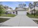Inviting home exterior with a well-maintained lawn, a two-car garage, and classic curb appeal in a friendly neighborhood at 278 Decatur Dr, Summerville, SC 29483