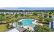 Beautiful community pool surrounded by palm trees, lounge chairs, and serene water views for the ultimate relaxation at 278 Decatur Dr, Summerville, SC 29483