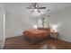 A relaxing bedroom features hardwood floors, a ceiling fan, and a window that lets in natural light at 2831 Chicopee Dr, North Charleston, SC 29420
