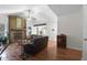Spacious living room with a stone fireplace, hardwood floors, and lots of natural light at 2831 Chicopee Dr, North Charleston, SC 29420