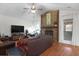 Cozy living room with a stone fireplace, hardwood floors, and plenty of space to relax at 2831 Chicopee Dr, North Charleston, SC 29420