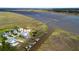 Stunning aerial view of waterfront homes with private docks and scenic marshland at 3095 S Shore Dr, Charleston, SC 29407