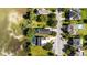 An aerial view shows a marsh-front home with a pool and solar panels near the street at 3095 S Shore Dr, Charleston, SC 29407