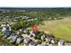 Aerial view of a charming neighborhood with lush green landscape and mature trees at 3095 S Shore Dr, Charleston, SC 29407