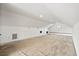 Expansive attic space with neutral carpeting, window seat and recessed lighting at 3095 S Shore Dr, Charleston, SC 29407
