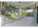 Expansive porch with views of marshland and white railings at 3095 S Shore Dr, Charleston, SC 29407