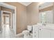 Bathroom featuring tile floors, neutral walls, a single sink vanity and a toilet at 3095 S Shore Dr, Charleston, SC 29407