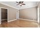 Bedroom featuring wood floors, walk in closet, neutral walls and fan at 3095 S Shore Dr, Charleston, SC 29407