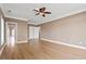 Spacious bedroom with light wood floors and ceiling fan at 3095 S Shore Dr, Charleston, SC 29407