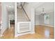 Bright foyer with hardwood floors, stairs, and chandelier at 3095 S Shore Dr, Charleston, SC 29407