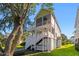 The exterior features multiple porches, a screened porch, and backyard access at 3095 S Shore Dr, Charleston, SC 29407