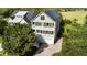 Charming home with double porches, lush landscaping, and solar panels on the roof at 3095 S Shore Dr, Charleston, SC 29407