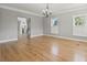 Open-concept living room with hardwood floors and natural light at 3095 S Shore Dr, Charleston, SC 29407
