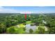 Aerial view of a golf course community with pond and lush green trees, pointed to 3221 Johnstown St at 3221 Johnstowne St, Johns Island, SC 29455