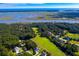 Expansive aerial view of the coastal community featuring golf course, waterways, and beautiful homes at 3221 Johnstowne St, Johns Island, SC 29455