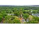 Aerial view of a charming home nestled among lush trees in a desirable neighborhood near a golf course and waterways at 3221 Johnstowne St, Johns Island, SC 29455