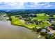 Breathtaking aerial view of the golf course community, showcasing lush landscaping and waterfront access at 3221 Johnstowne St, Johns Island, SC 29455