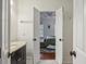 Bathroom view through an open doorway, showcasing a vanity and a peek into the adjacent bedroom at 3221 Johnstowne St, Johns Island, SC 29455