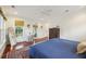 Bright main bedroom featuring hardwood floors, large windows, and a stylish rug at 3221 Johnstowne St, Johns Island, SC 29455