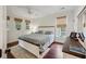 Well-lit bedroom with wood floors, neutral-toned walls, a bed, and dark furniture with a modern feel at 3221 Johnstowne St, Johns Island, SC 29455