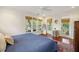 Bright main bedroom featuring hardwood floors, large windows, and a stylish rug at 3221 Johnstowne St, Johns Island, SC 29455