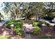 Well-manicured common area featuring mature trees draped with Spanish moss and a brick-lined entrance at 3221 Johnstowne St, Johns Island, SC 29455