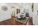 Elegant dining room with modern light fixture, hardwood floors, and neutral decor at 3221 Johnstowne St, Johns Island, SC 29455