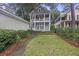 Charming two-story home with a manicured yard and inviting curb appeal in lush surroundings at 3221 Johnstowne St, Johns Island, SC 29455