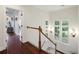 Hallway with hardwood floors, white wainscoting, and bright windows at 3221 Johnstowne St, Johns Island, SC 29455